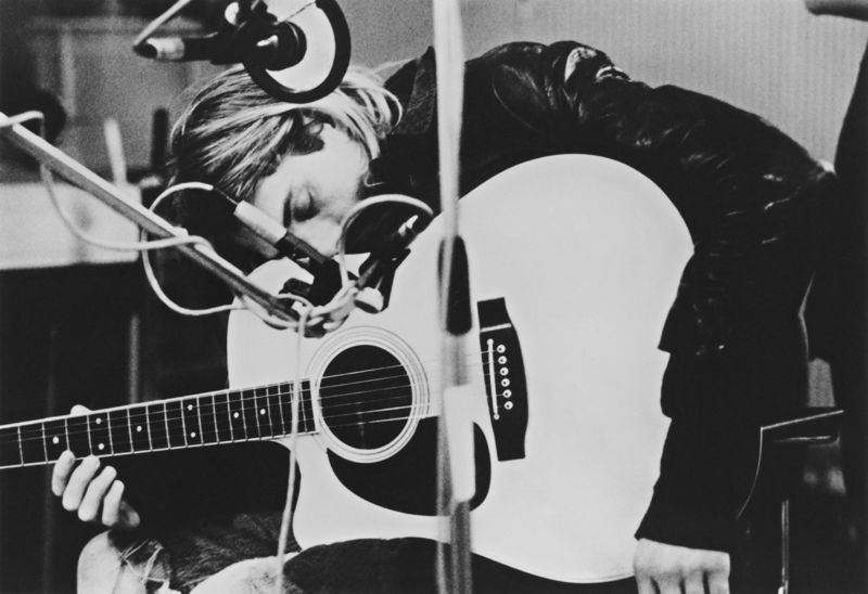 Cobain Resting on his Guitar