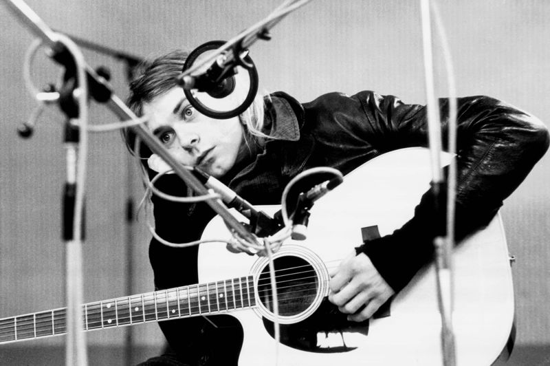 Cobain Resting on his Guitar